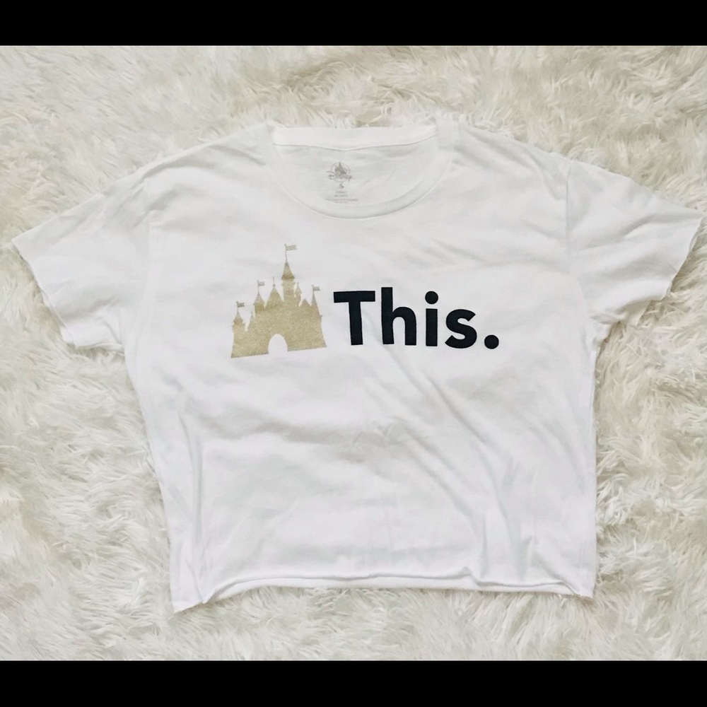 Disney white tee semi see-through size small accents of gold and black.